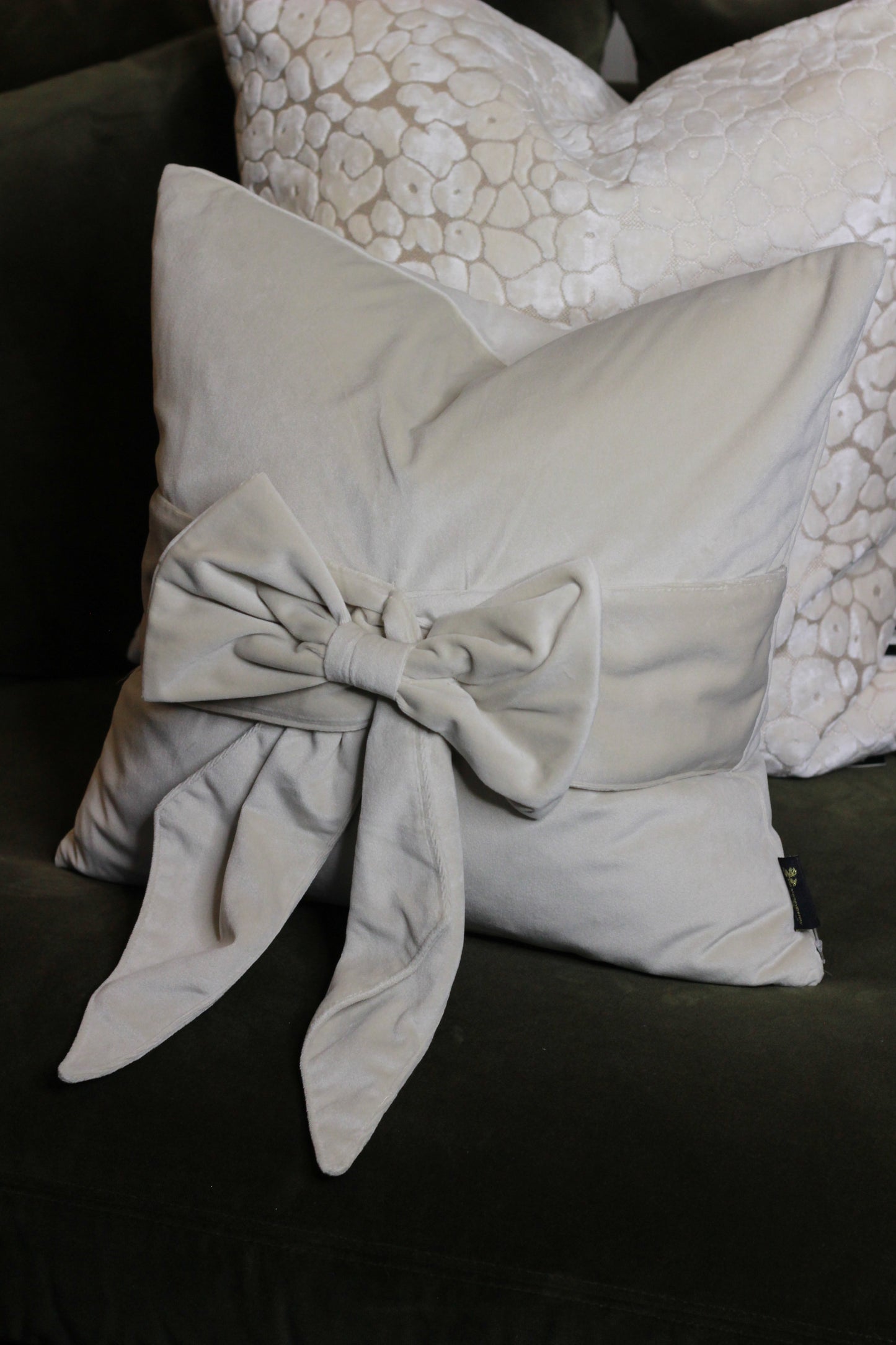 Cream Bow Velvet Cushion styled view – Leya Buster Interiors