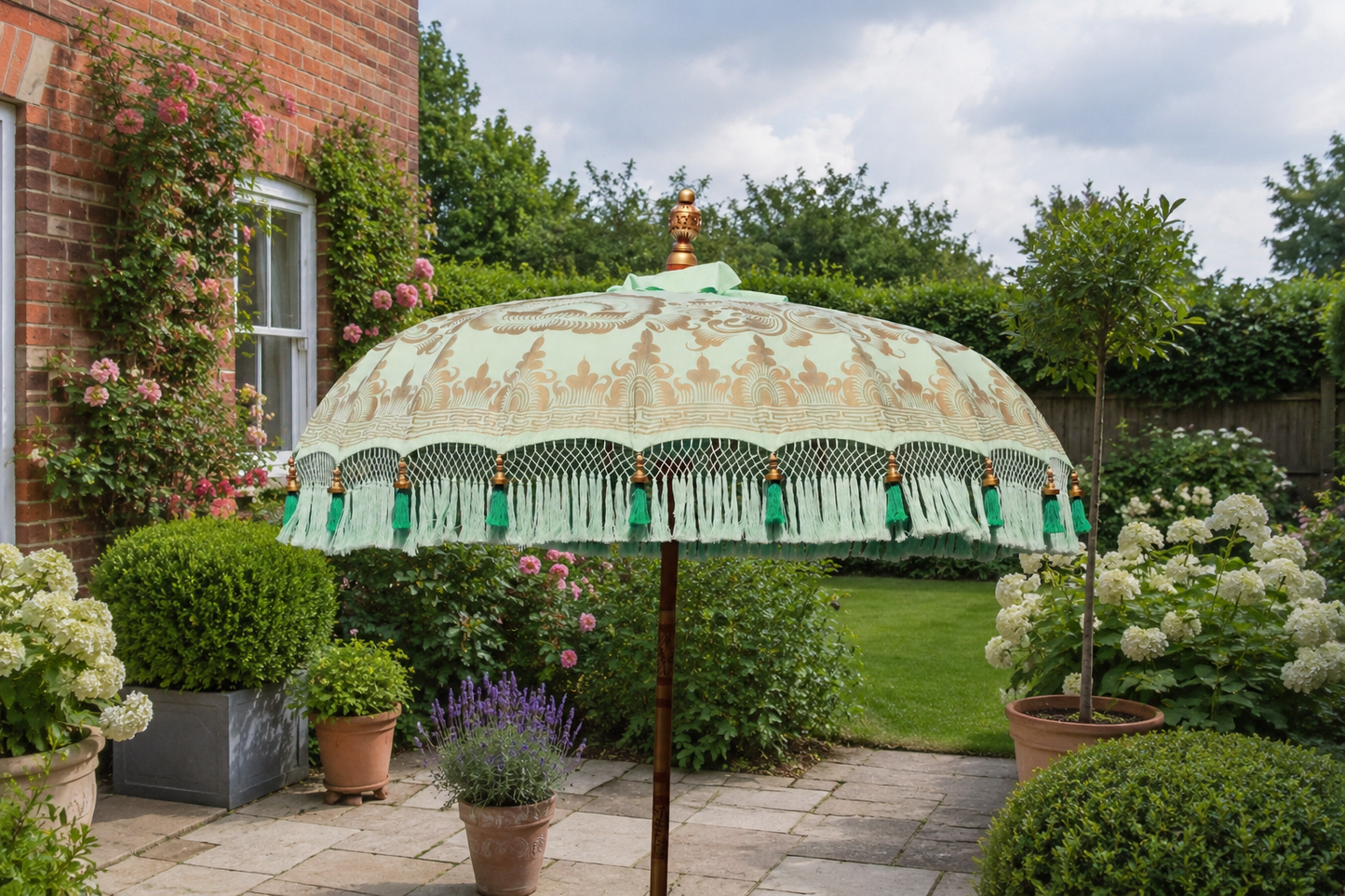 Hand painted mint and gold handmade Balinese-style garden parasol styled in a realistic English back garden