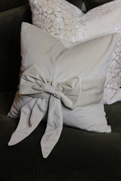 Cream Bow Velvet Cushion styled view – Leya Buster Interiors