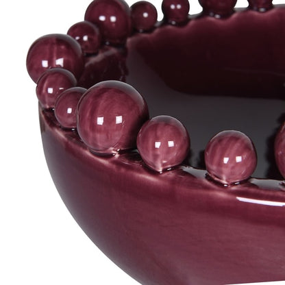 Sculptural burgundy ceramic decorative bowl with bobble edge