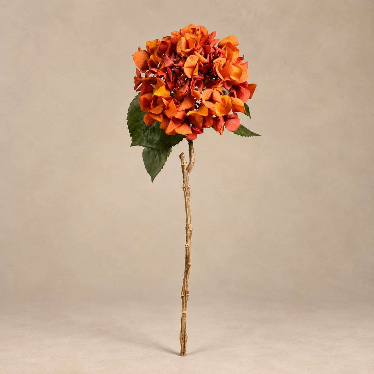 Single burnt orange real touch garden hydrangea stem showing its flower head, leaves and full length