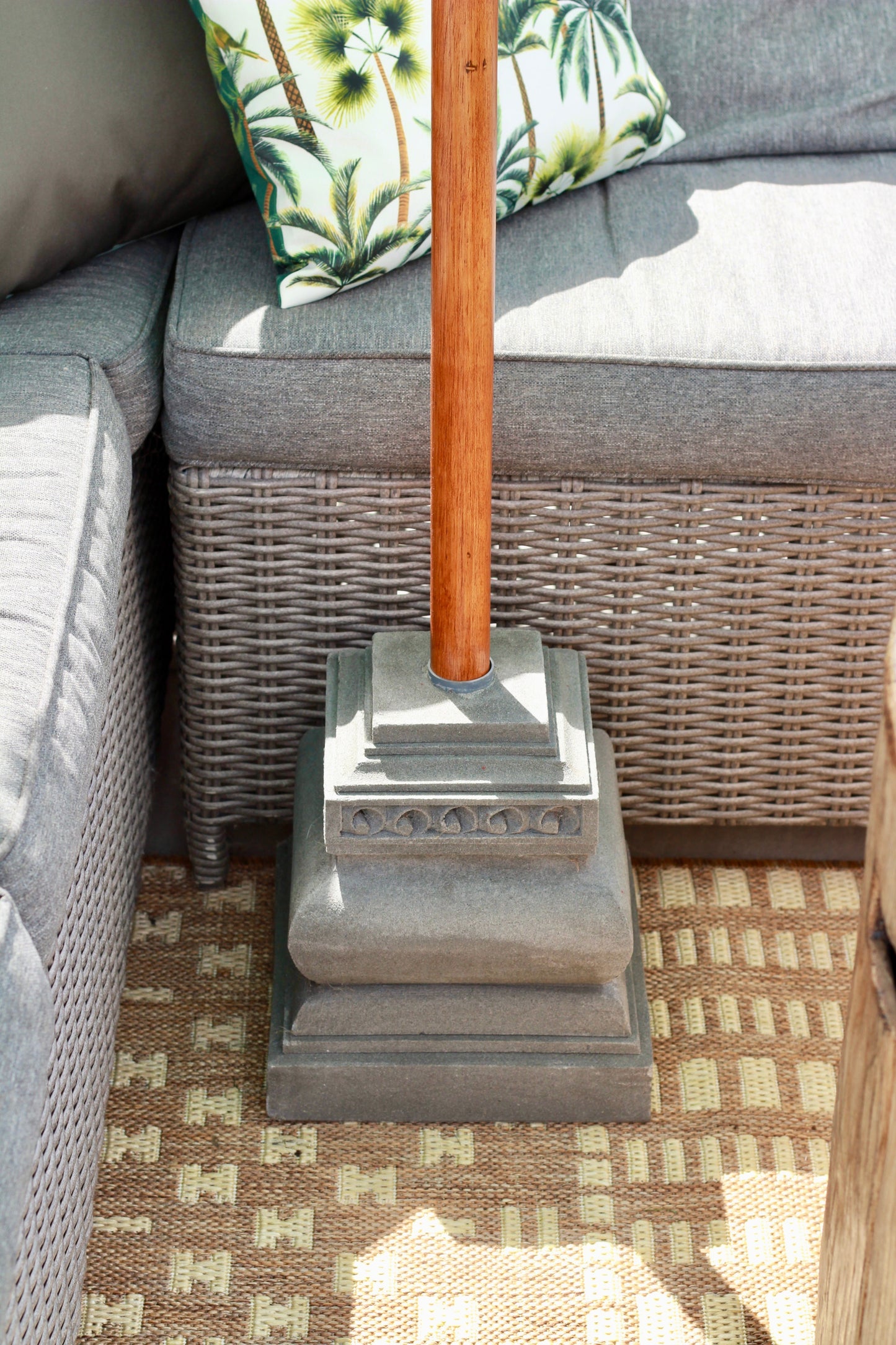 Luxury outdoor living scene with handmade Balinese-style mint garden parasol and tassel detail
