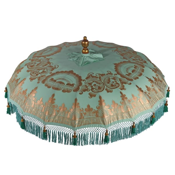 Close detail of handmade Balinese-style mint parasol fringe and green tassel edging